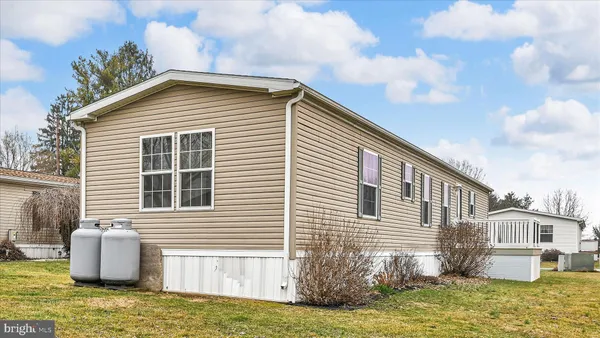 a view of a house with a yard and garage