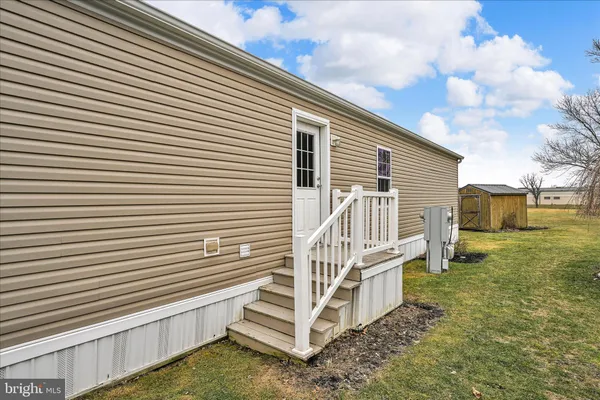 a view of a backyard of the house