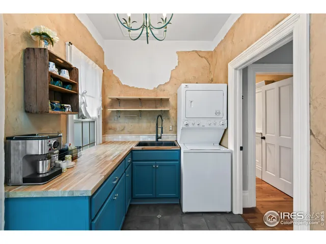 a bathroom with a granite countertop sink mirror and shower