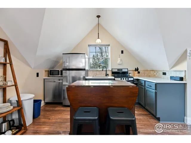 a bed room with a bed window and dresser