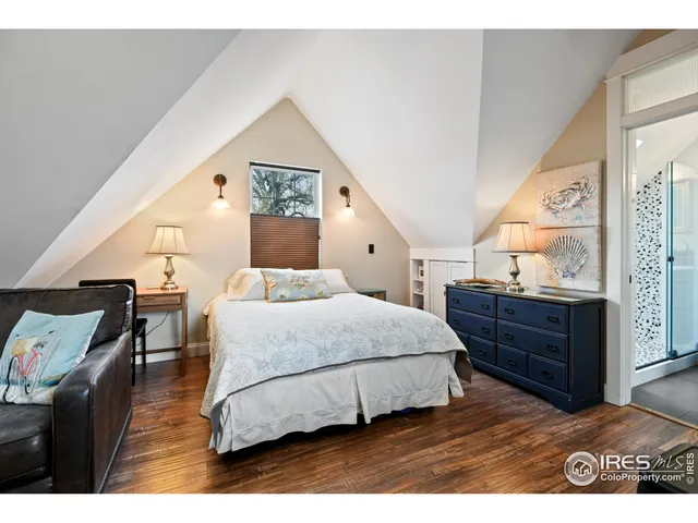 a living room with lots of furniture and kitchen view