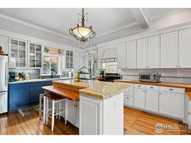 a kitchen with stainless steel appliances kitchen island a large island in the center