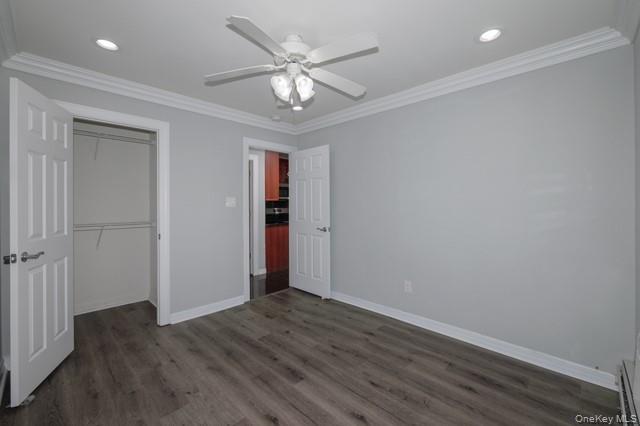 118 Carleton Avenue, Unit 7A Islip Terrace, NY 11752 - Photo 7 of 9 wooden floor in an empty room with a window