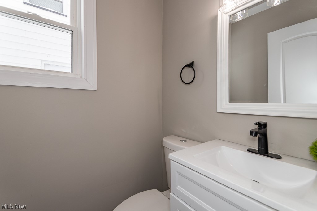 4980 Emmet Road Lyndhurst, OH 44124 - Photo 14 of 39 Bathroom featuring toilet and large vanity