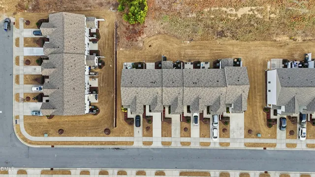 a aerial view of a house with a yard