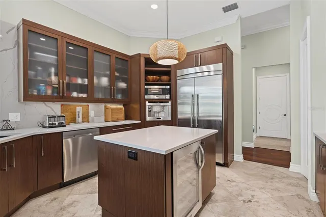 a spacious bedroom with a bed and a dresser next to a window