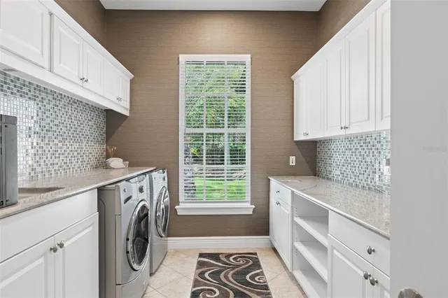 a kitchen with granite countertop a sink and a stove