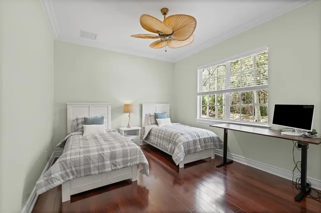 a view of a lake with a garden and bench