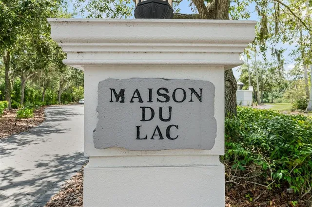 a view of an entryway with wooden floor windows and a livingroom