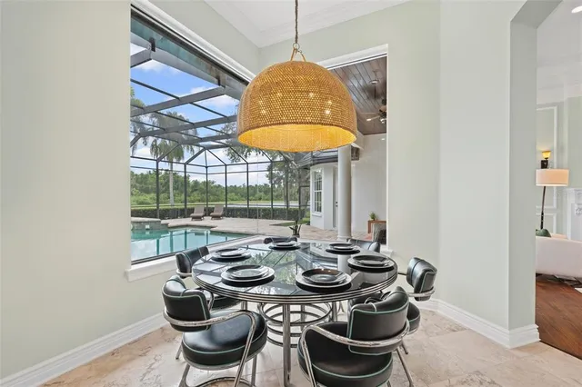 a living room with fireplace furniture and a large window