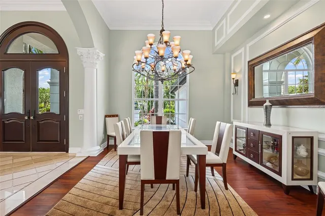 a living room with furniture and a view of kitchen