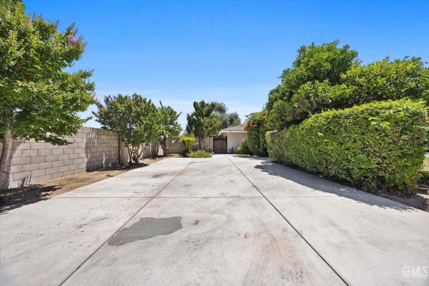 Undisclosed Address Bakersfield, CA 93308 - Photo 14 of 50 a view of a yard with plants