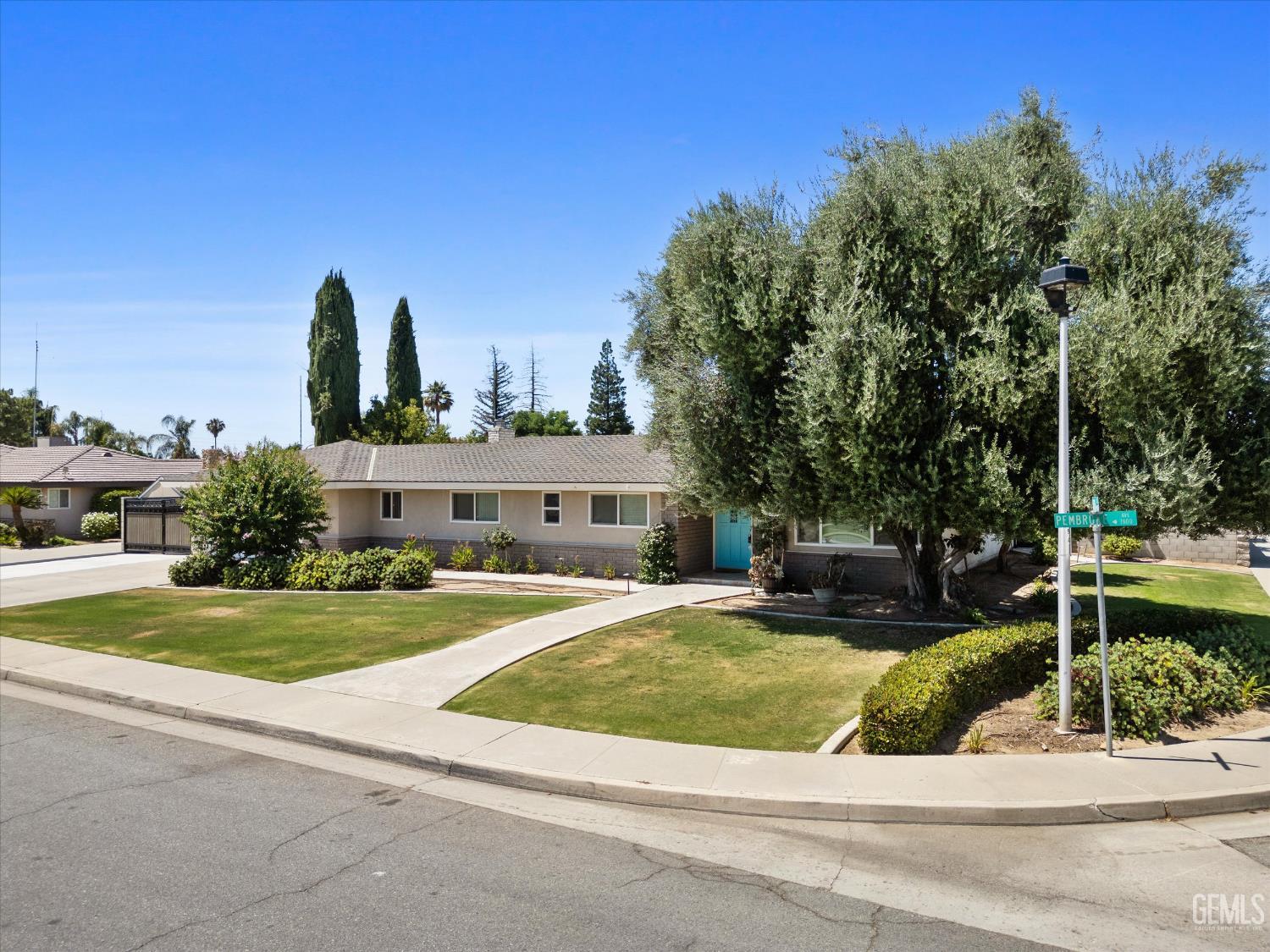 Undisclosed Address Bakersfield, CA 93308 - Photo 18 of 50 a view of a house with a yard and plants