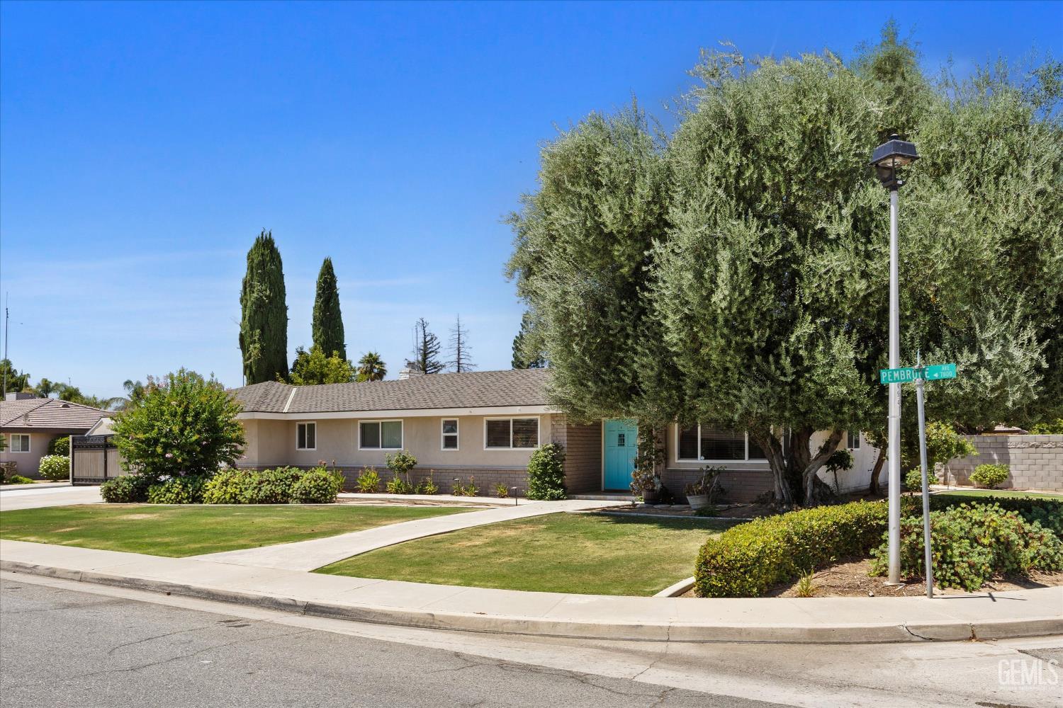 Undisclosed Address Bakersfield, CA 93308 - Photo 21 of 50 a front view of a house with garden