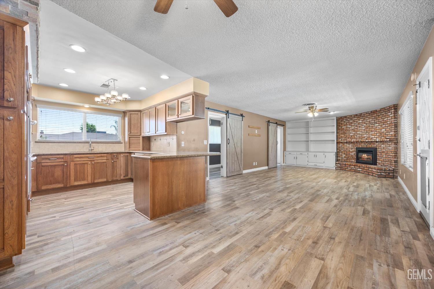 Undisclosed Address Bakersfield, CA 93308 - Photo 27 of 50 a view of kitchen with wooden floor