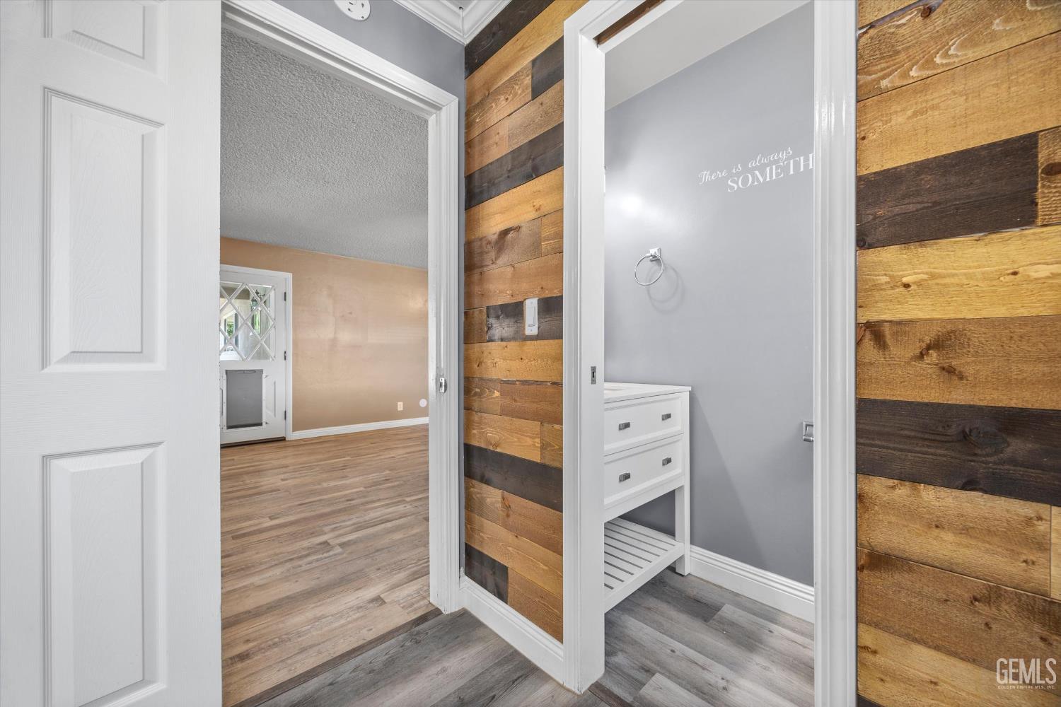 Undisclosed Address Bakersfield, CA 93308 - Photo 34 of 50 a view of closet with wooden floor