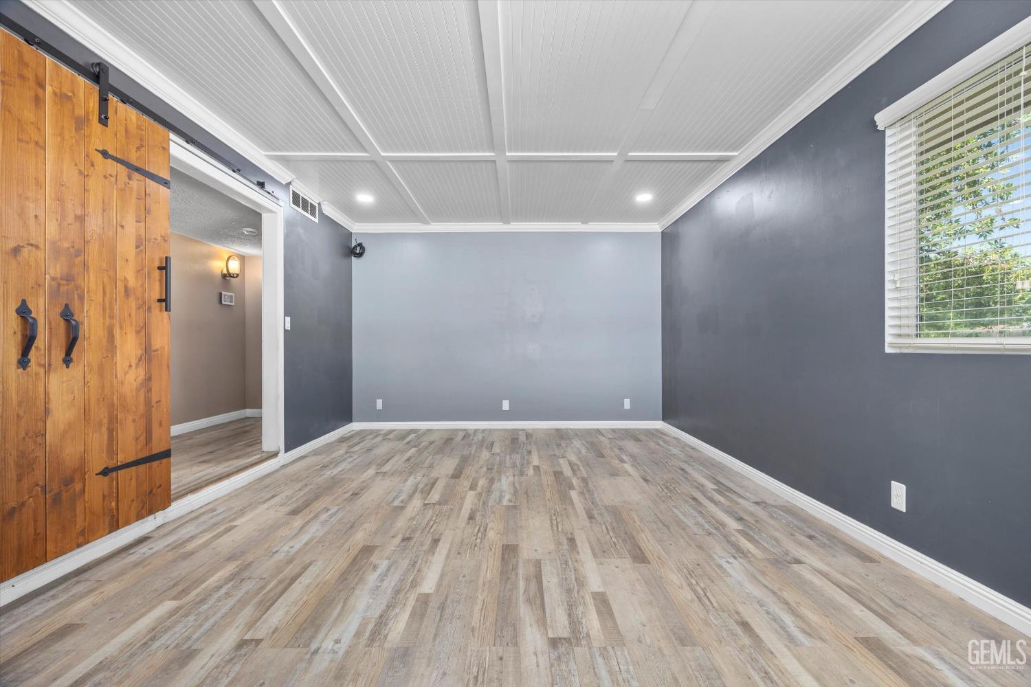 Undisclosed Address Bakersfield, CA 93308 - Photo 36 of 50 a view of empty room with wooden floor and fan