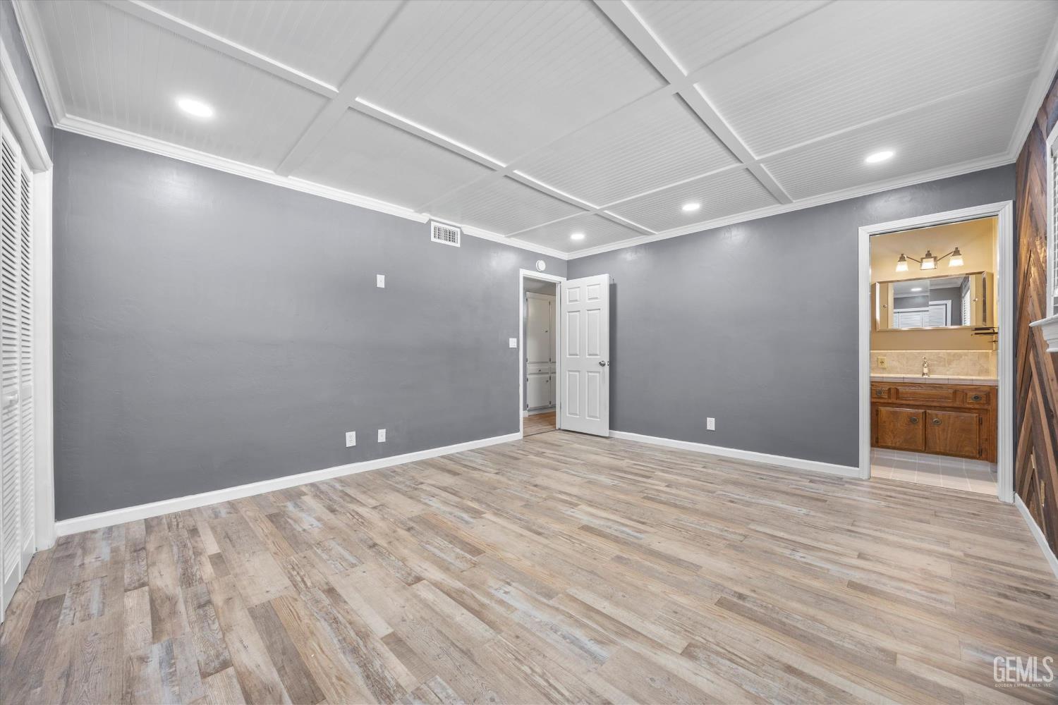 Undisclosed Address Bakersfield, CA 93308 - Photo 40 of 50 a view of an empty room with wooden floor