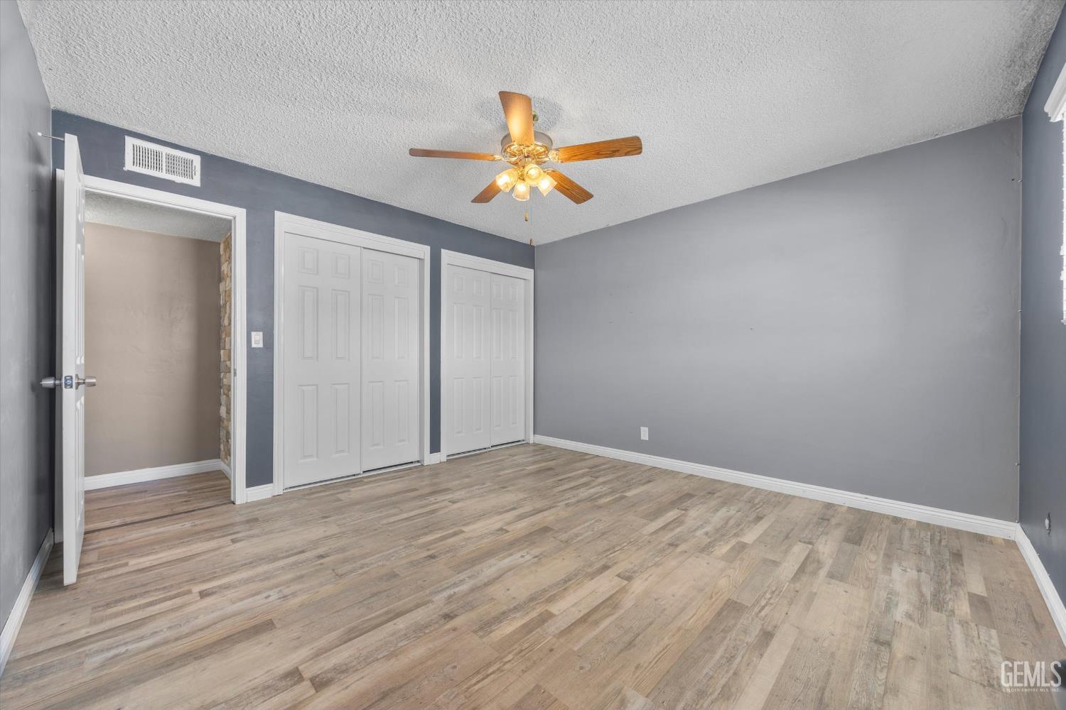 Undisclosed Address Bakersfield, CA 93308 - Photo 43 of 50 a view of empty room with wooden floor