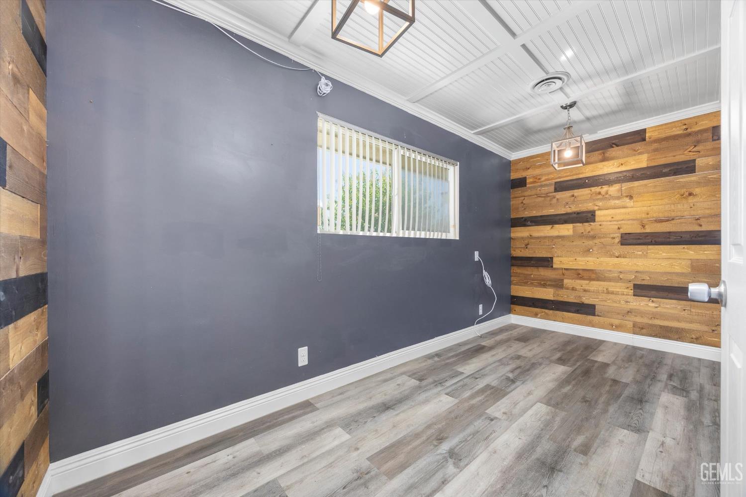 Undisclosed Address Bakersfield, CA 93308 - Photo 8 of 50 a view of room with window and wooden floor