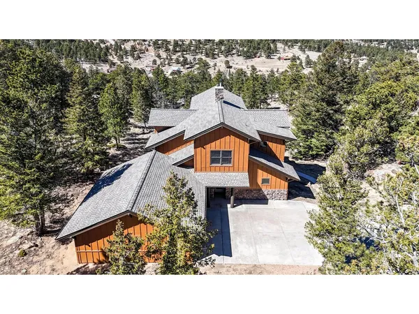a aerial view of a house with a yard