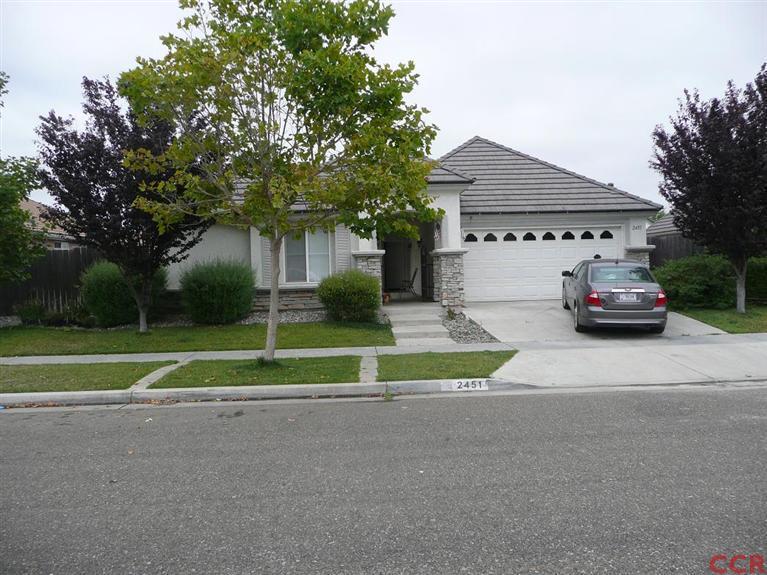 2451 Bicknell Avenue Santa Maria, CA 93458 - Photo 1 of 10 a white house that has a tree in front of it