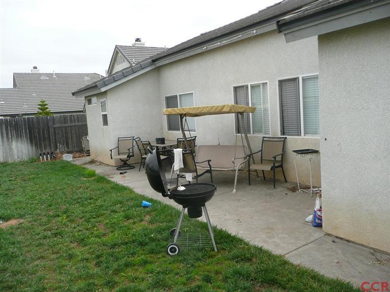 2451 Bicknell Avenue Santa Maria, CA 93458 - Photo 2 of 10 a view of a chair and table in backyard of the house