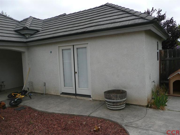 2451 Bicknell Avenue Santa Maria, CA 93458 - Photo 5 of 10 a backyard of a house with barbeque oven and potted plants