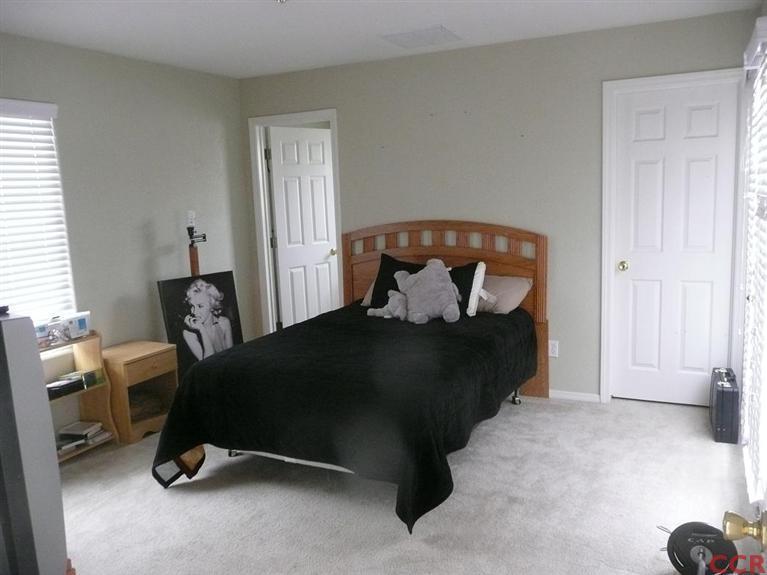 2451 Bicknell Avenue Santa Maria, CA 93458 - Photo 9 of 10 a bedroom with a bed and a chair