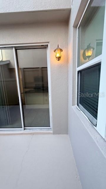 13718 Beckman Drive Windermere, FL 34786 - Photo 19 of 20 a view of an empty room with a fireplace and wooden floor