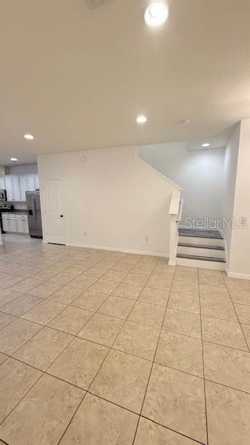 13718 Beckman Drive Windermere, FL 34786 - Photo 6 of 20 a view of an empty room with wooden floor
