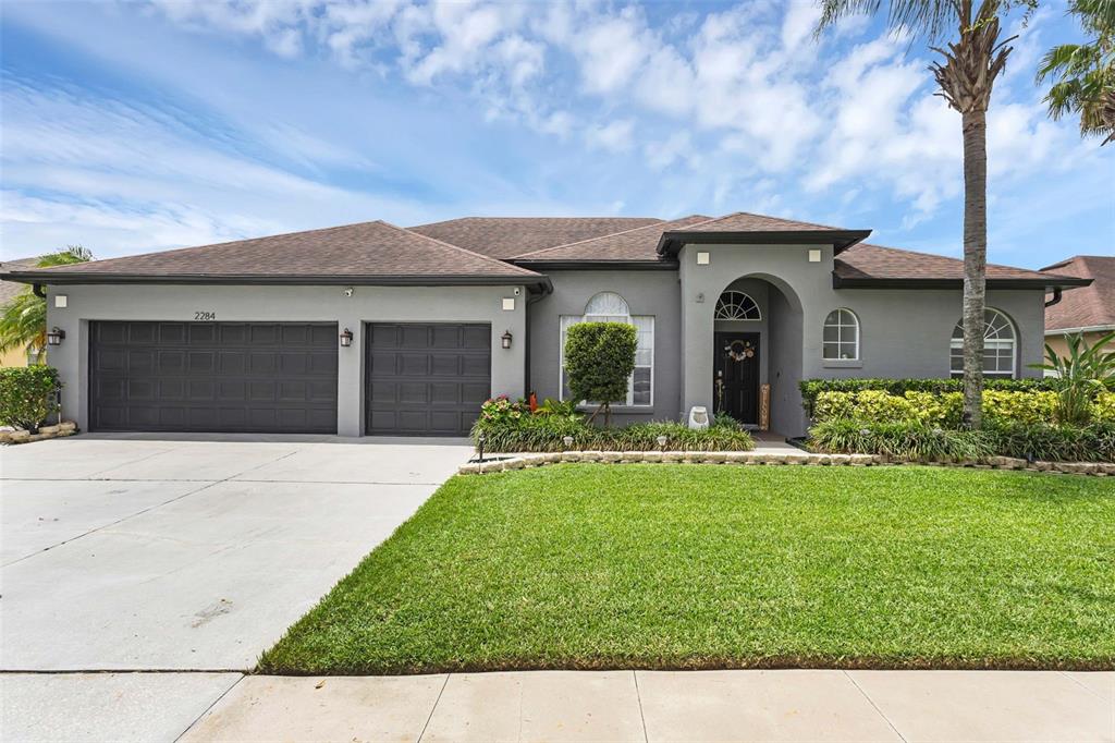 2284 Blackjack Oak Street Ocoee, FL 34761 - Photo 1 of 1 a front view of a house with a yard and garage