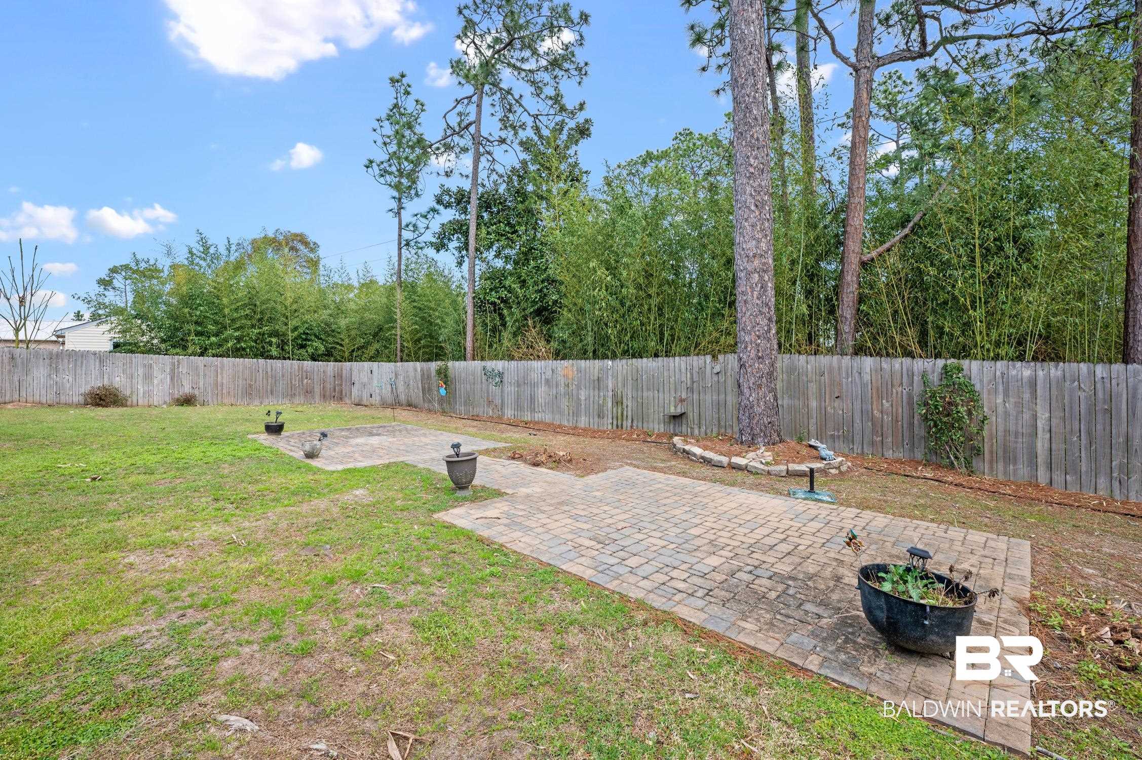 2553 Santa Rosa Drive Lillian, AL 36549 - Photo 39 of 51 View of yard with a patio and a fenced backyard