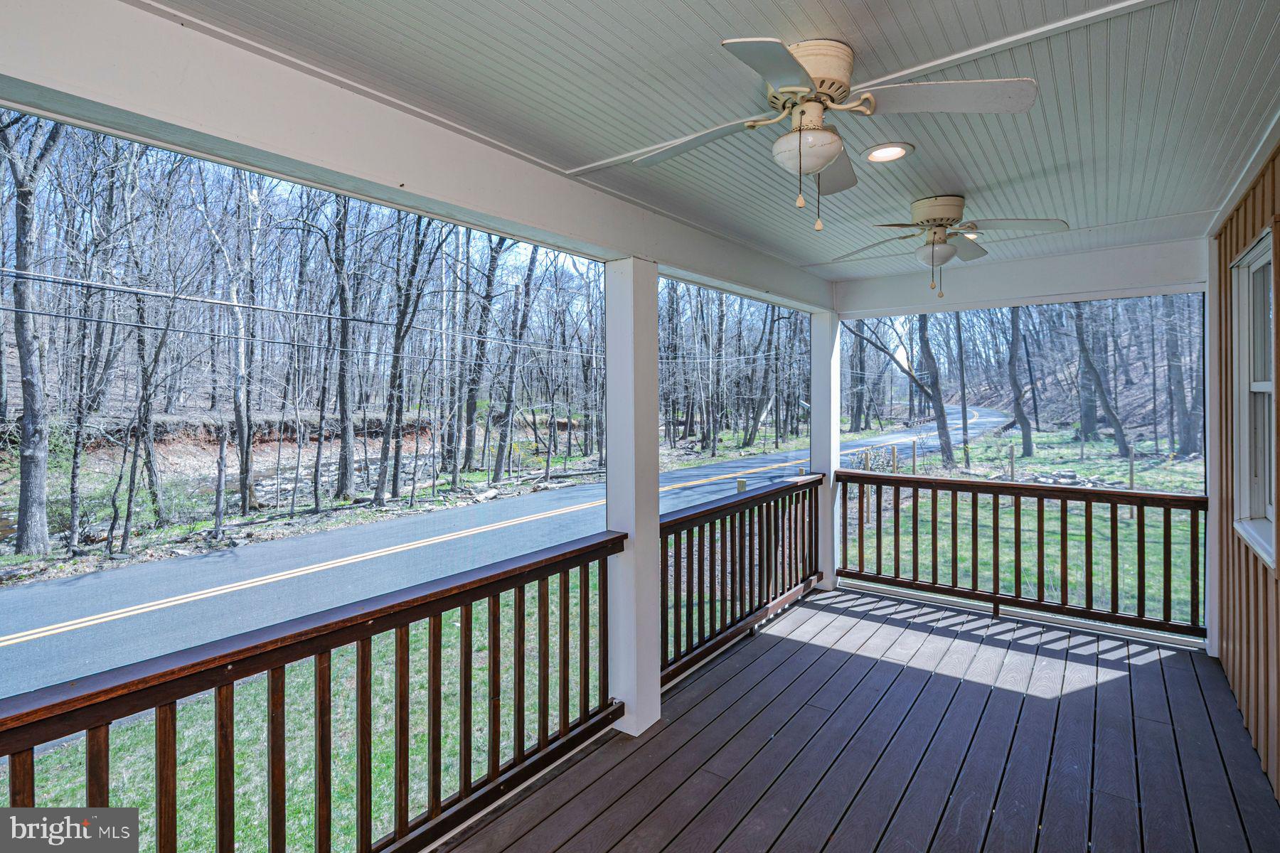 310 Hollow Road Skillman, NJ 08558 - Photo 15 of 32 a view of a porch with wooden floor