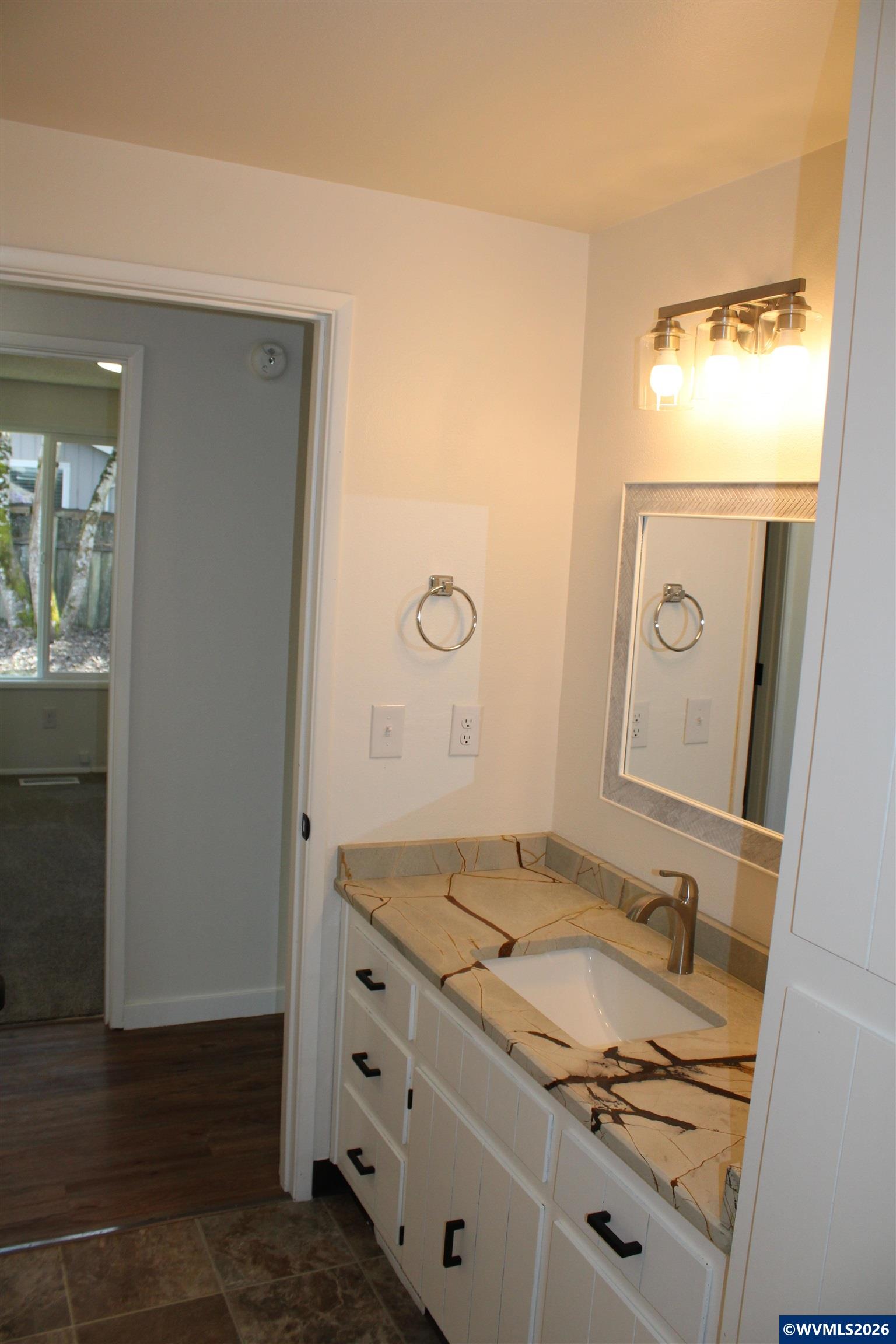 6259 Chapman Place Southwest Albany, OR 97321 - Photo 13 of 21 a bathroom with a granite countertop sink and a mirror