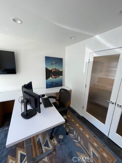 395 2nd Street, Unit C Laguna Beach, CA 92651 - Photo 5 of 7 a work room with furniture and a flat screen tv