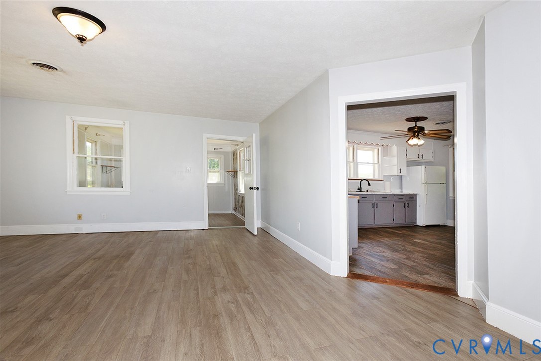 9903 Boze Road Ford, VA 23850 - Photo 5 of 45 wooden floor in an empty room with a bathroom