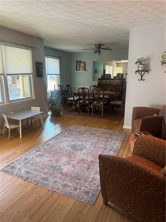 1455 Timberlane Road Snellville, GA 30078 - Photo 16 of 25 a living room with furniture and a wooden floor
