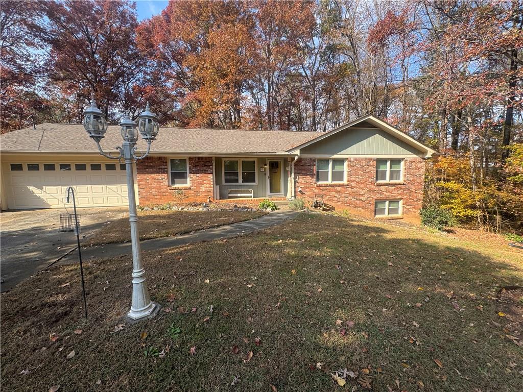 1455 Timberlane Road Snellville, GA 30078 - Photo 2 of 25 a view of a house with a yard