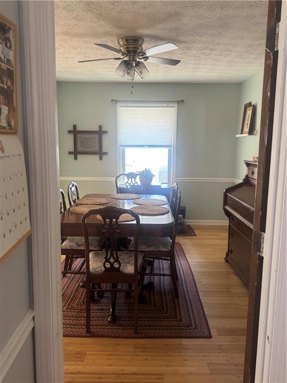 1455 Timberlane Road Snellville, GA 30078 - Photo 21 of 25 a view of a dining room with furniture and wooden floor