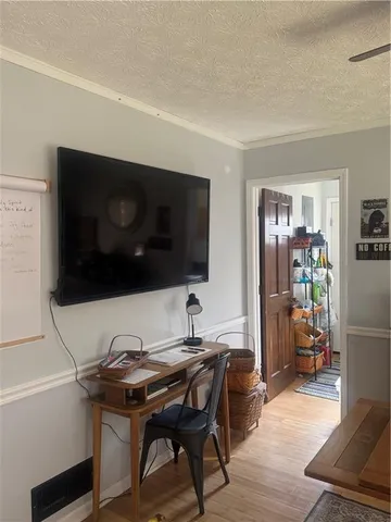 a living room with a couch and a flat screen tv
