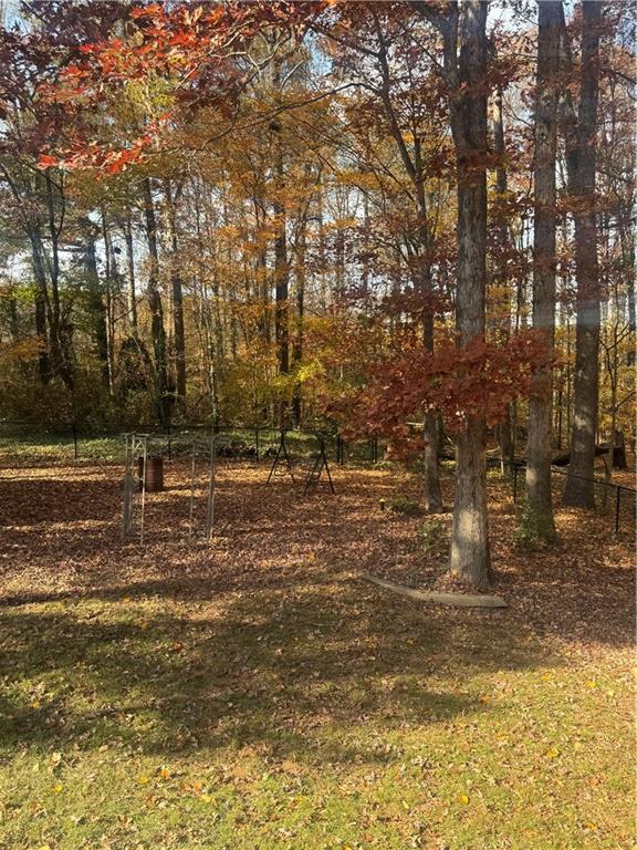 1455 Timberlane Road Snellville, GA 30078 - Photo 24 of 25 a view of a field with lots of trees