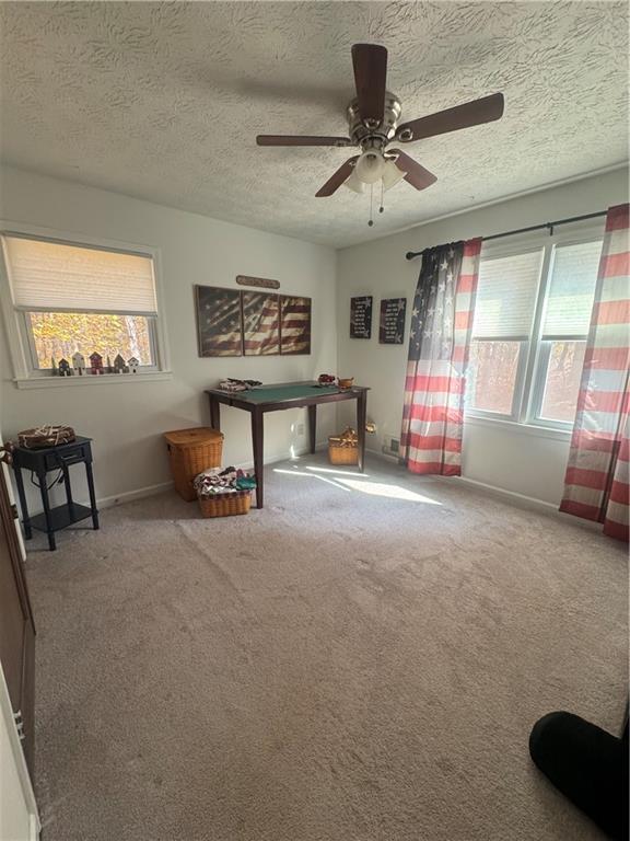 1455 Timberlane Road Snellville, GA 30078 - Photo 8 of 25 a view of a livingroom with furniture and a ceiling fan