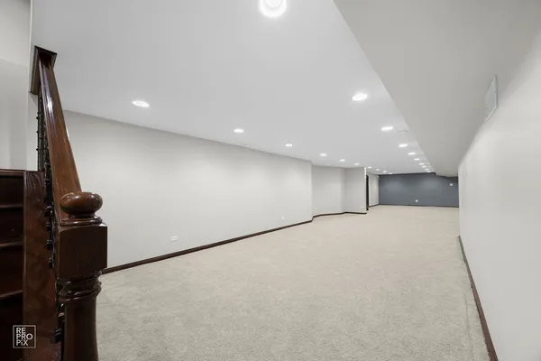 a view of a livingroom with furniture and a ceiling fan