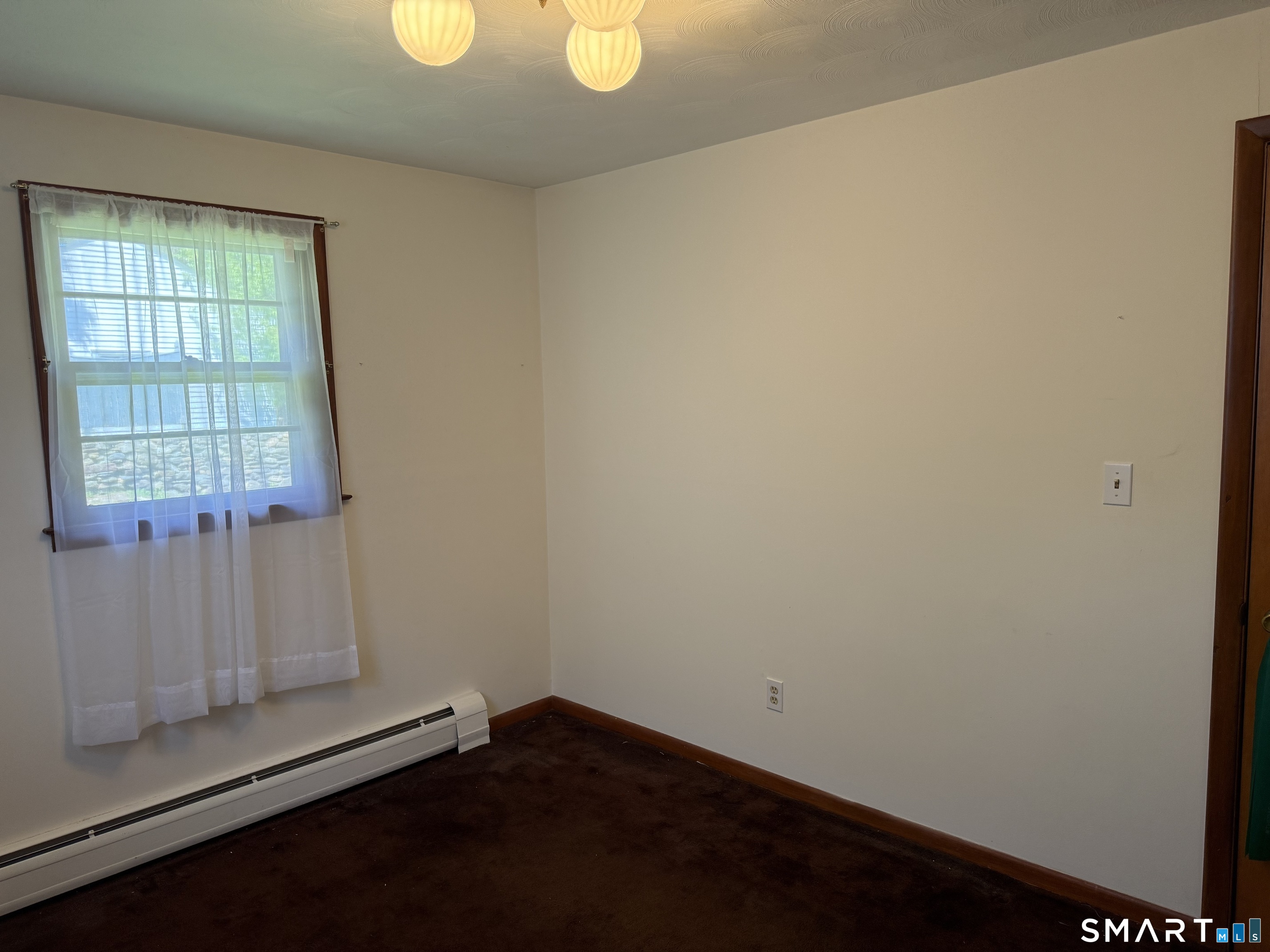 26 Maple Street Trumbull, CT 06611 - Photo 25 of 37 an empty room with wooden floor and windows