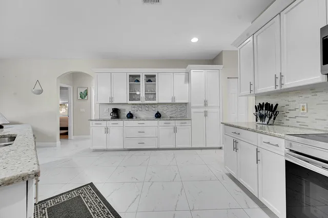 a view of kitchen and dining area with furniture