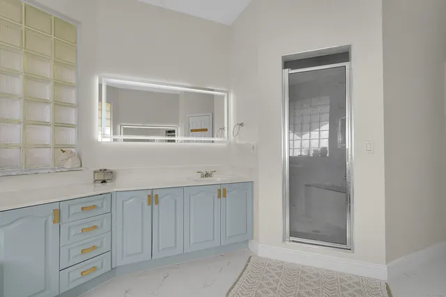 a living room with furniture a couch and a chandelier