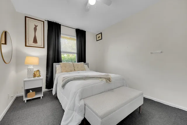 a bedroom with a bed and a television