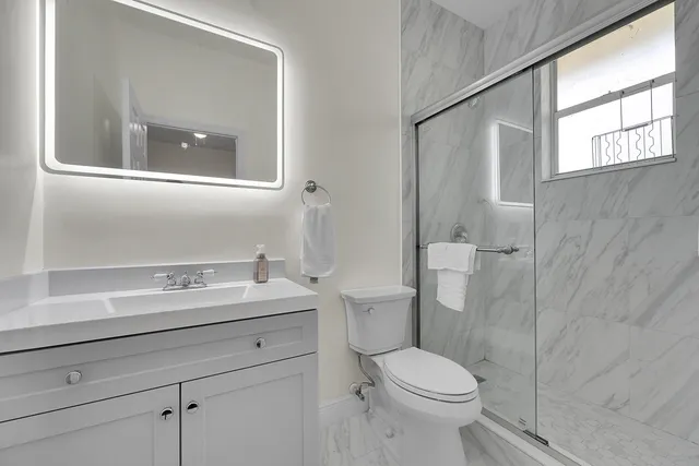 a bathroom with a sink and vanity