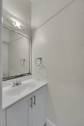 a view of a house with swimming pool and sitting area